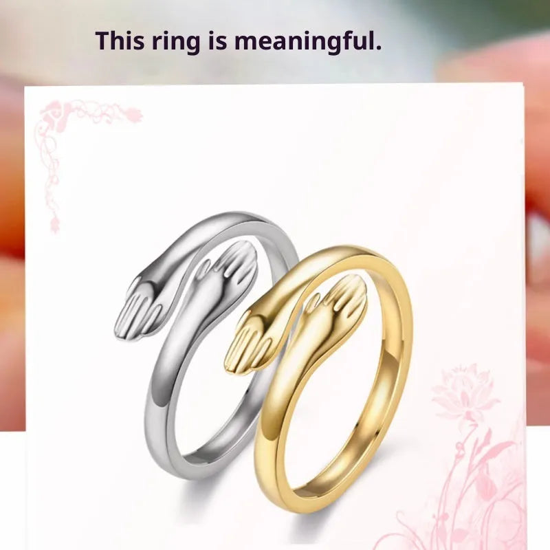 Geometric titanium steel ring with stamping finish in silver colour on a neutral background