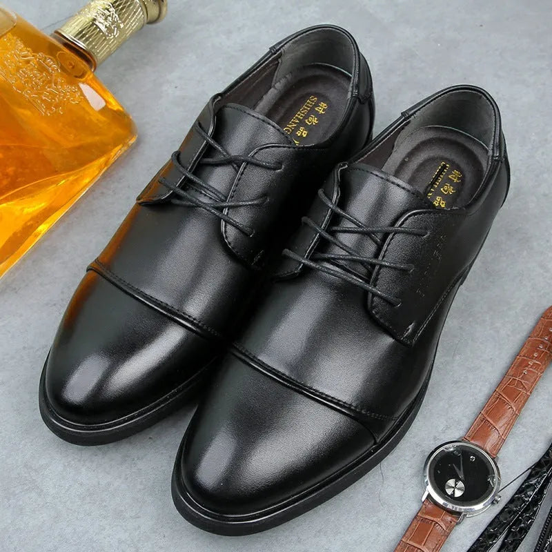 Men's black PU leather lace-up boot with stitching detail and a rubber sole on a neutral background