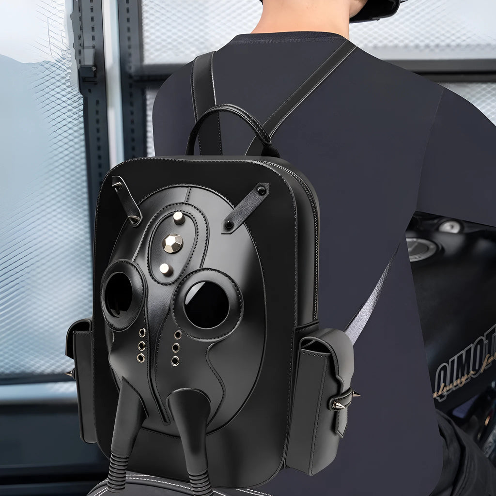 Black men's backpack with skull motif and silver studs on a structured PU body.