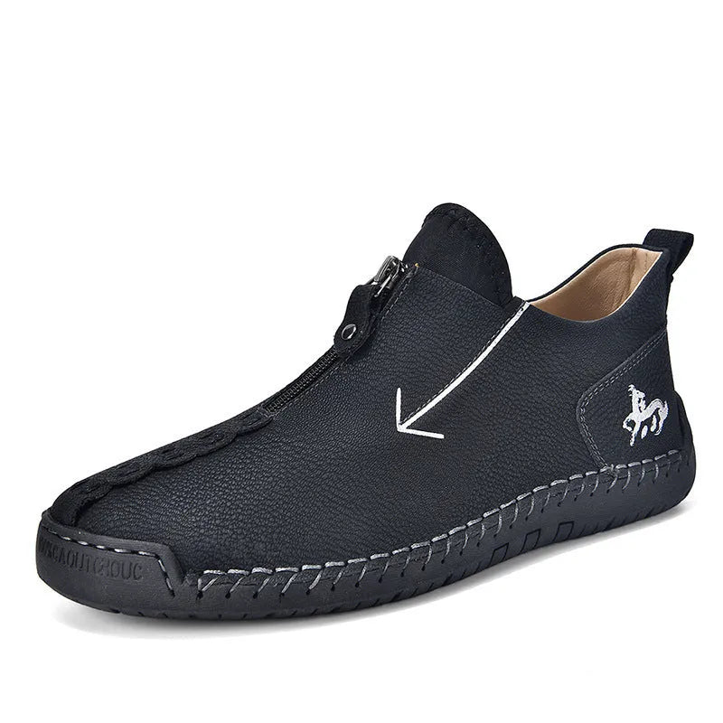 Men's black leather martin boots with a front zipper and round toe on a rubber sole.