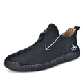 Men's black leather martin boots with a front zipper and round toe on a rubber sole.