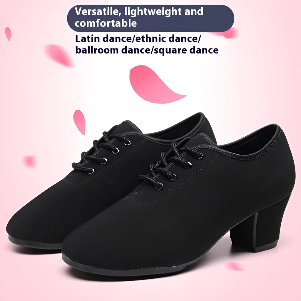Men's black oxford cloth ballroom dancing shoes with rubber sole and middle heel on a dance floor