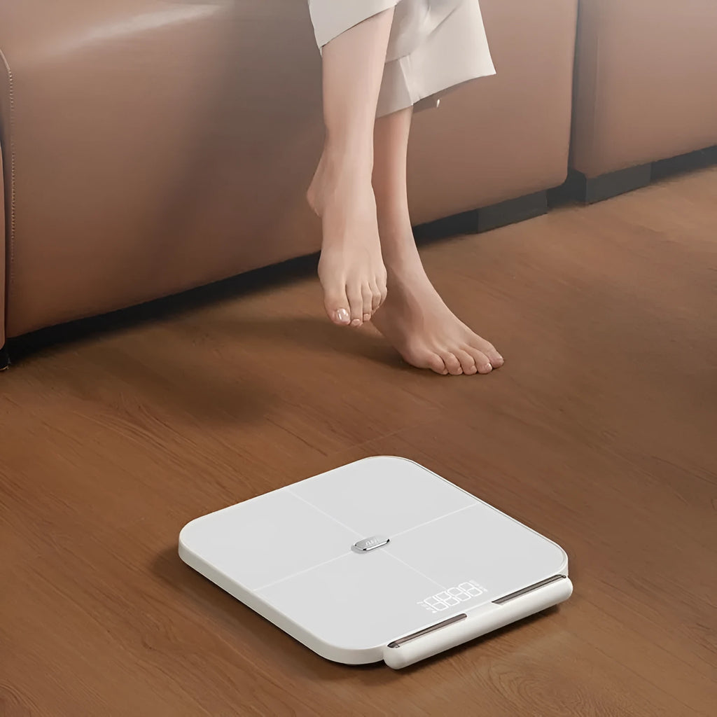 White professional body fat scale with 8 electrodes and a tempered glass platform.