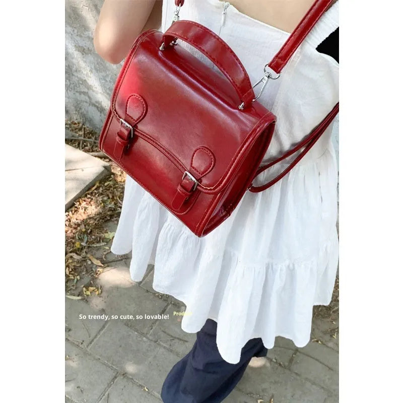 Simple PU backpack in urban college style, available in white, black, wine red, and silver, with polyester lining and sewing thread detail.