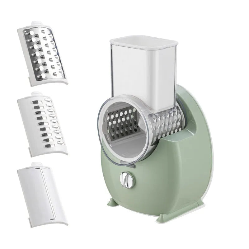 White electric vegetable slicer with rotary grater, suction base, and set of three blade pairs on a kitchen worktop.