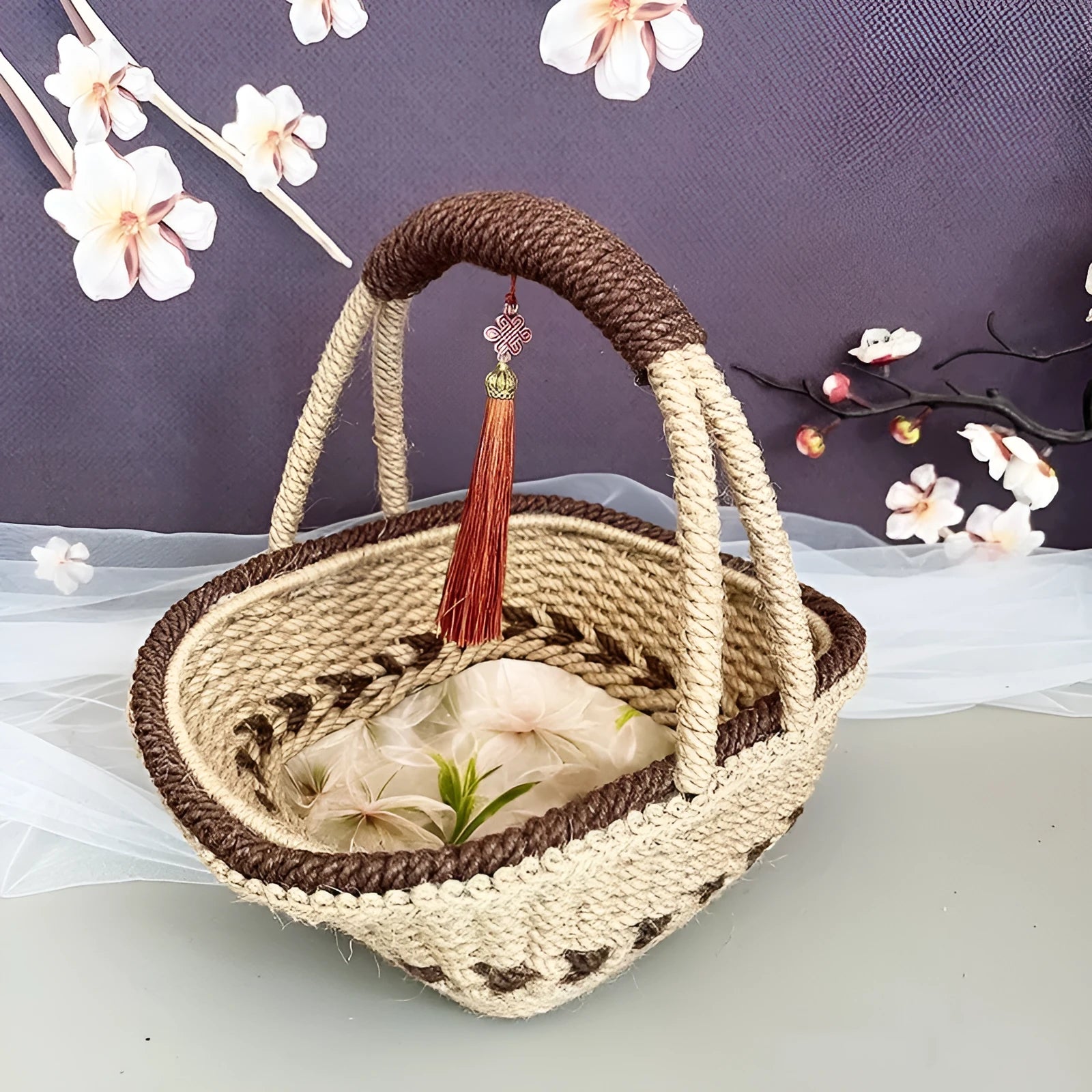 Coffee brown hand-woven straw basket with hemp rope accents measuring 19cm by 12cm