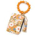 Women's floral print leather card bag in light pink with card slots inside