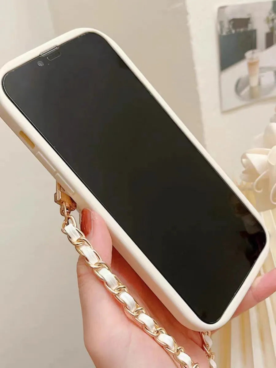 Silicone all-inclusive phone case with metal bow bear rhombus design, card holder, and black lanyard for Apple iPhone models