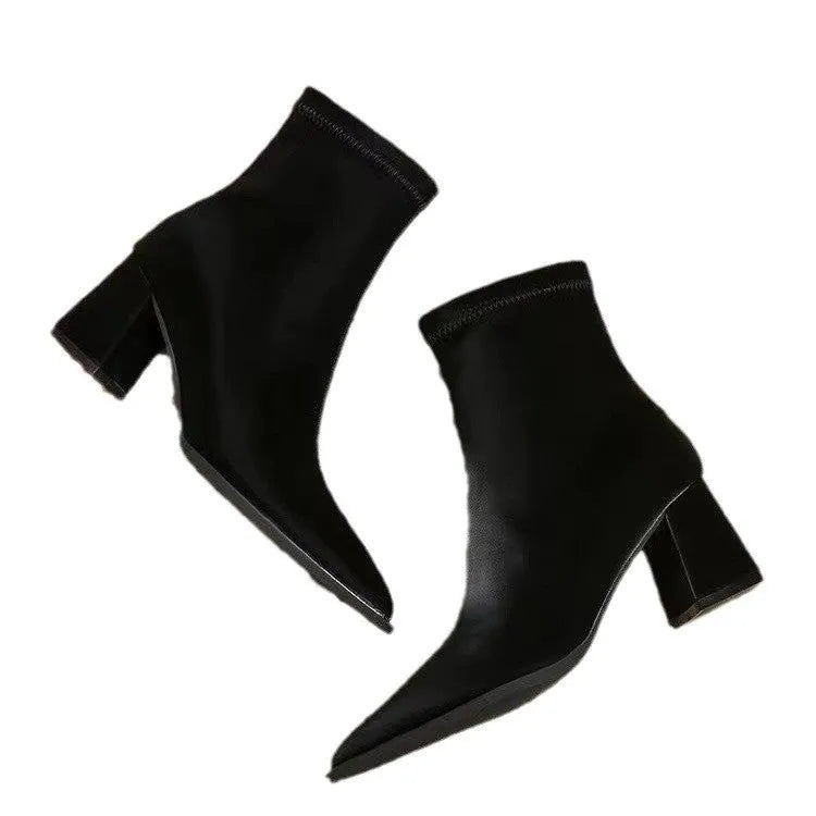 Women's khaki stretch suede pointed-toe boots with a wedge heel on a mid-calf.