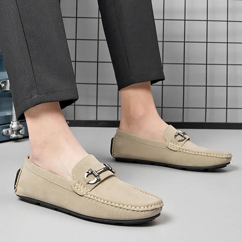 Men's beige leather casual loafers with a round toe and rubber sole.