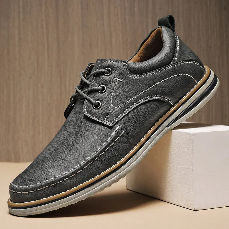 Men's genuine leather casual shoes in black with round toe and lace-up design on rubber sole