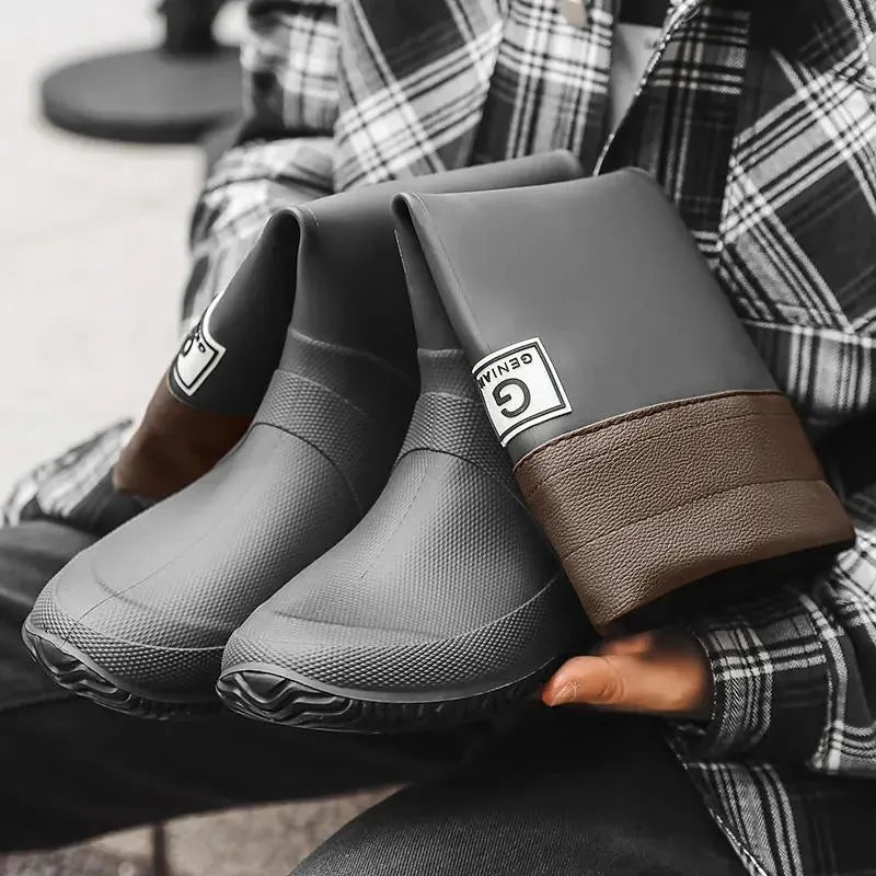 Pair of non-slip rain boots with plastic upper, leather stitching, flat heel and round toe, sizes 36-44