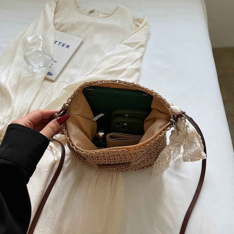 Women's woven straw messenger bag with hollowed design in khaki colour showing vertical square shape