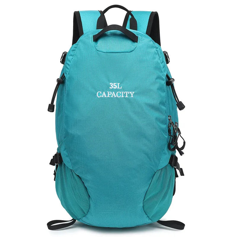 Black waterproof Oxford cloth hiking backpack with under 20 litre capacity, shown folded.