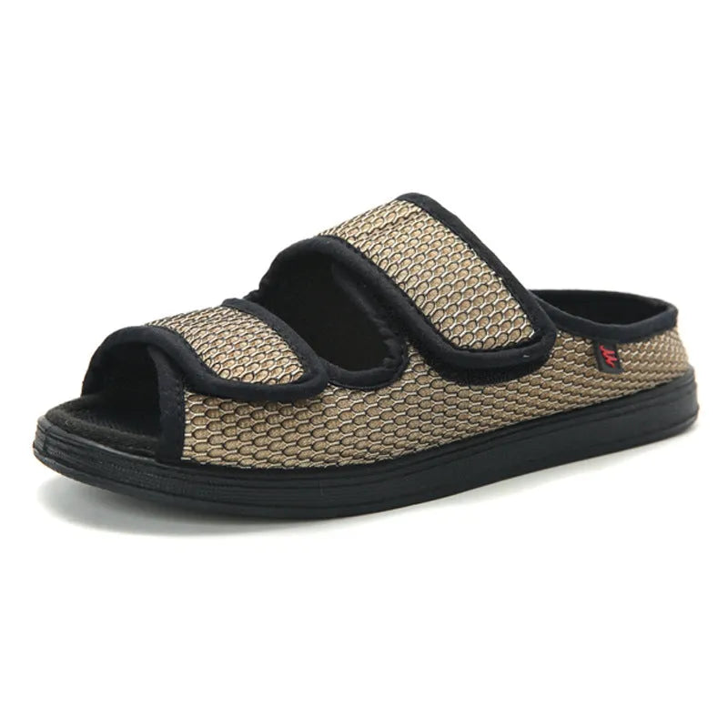 Wide puffy adjustable slippers with mesh upper and rubber sole in black colour