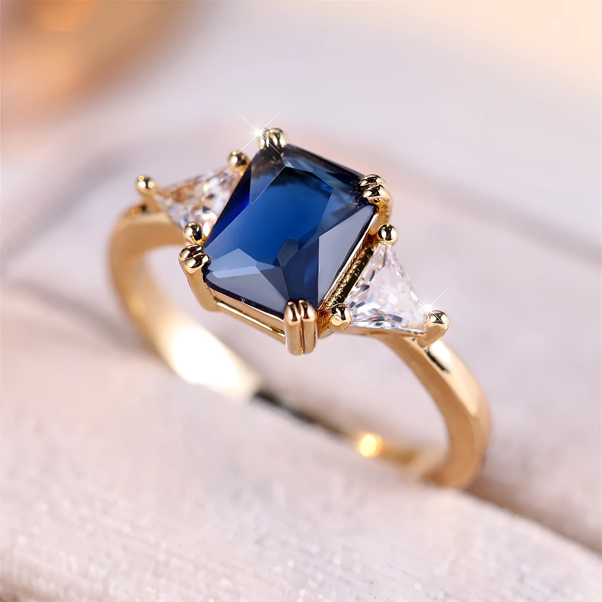Copper rectangular fashion ring for women in gold sapphire blue colour