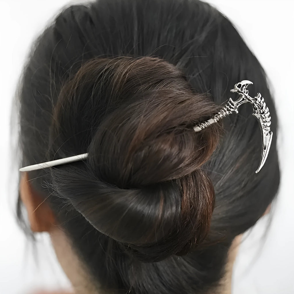Geometric retro skull sickle hairpin in ancient silver electroplated finish on neutral background