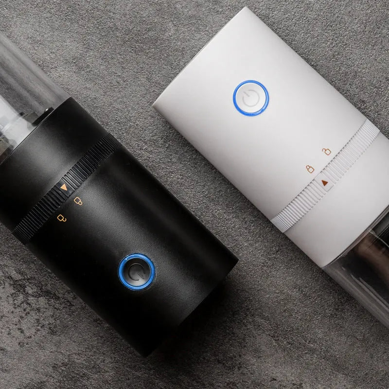 Portable black electric coffee grinder with transparent chamber and USB-C charging cable