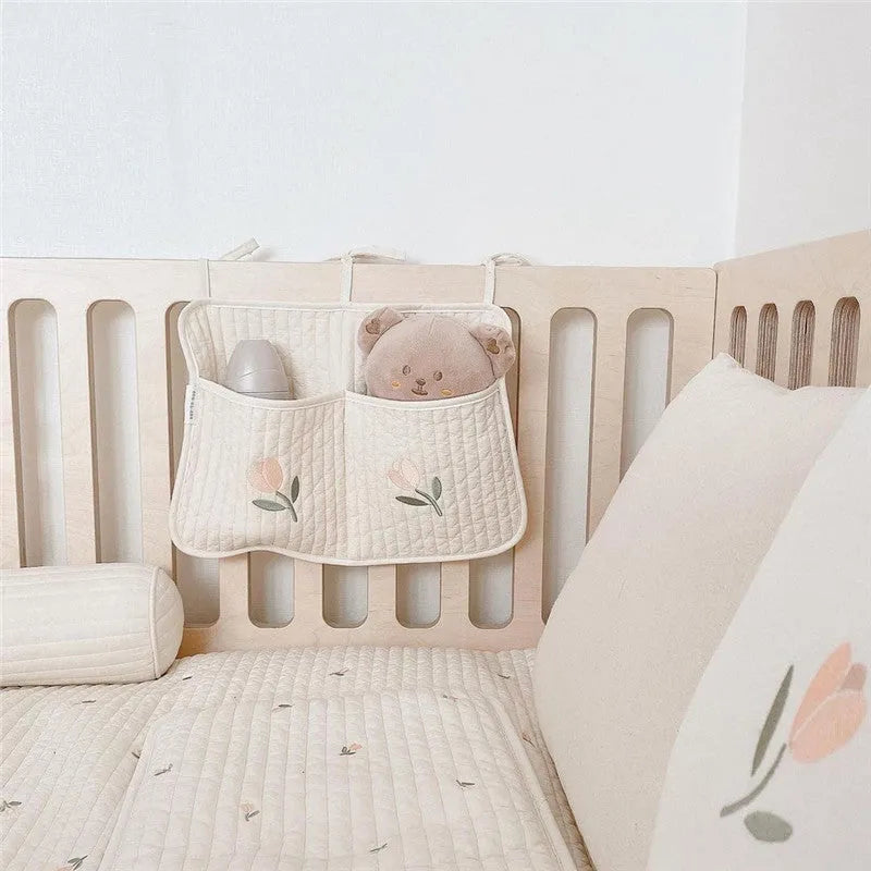 Cotton cloth hanging storage bag for baby bottles and diapers, available in six colours including bear, olive, and tulip