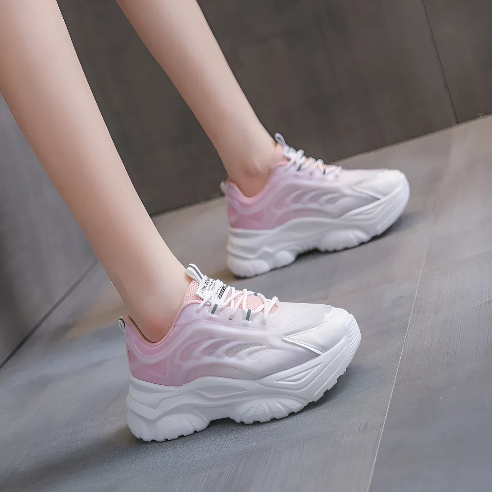 Women's pink satin lace-up casual shoes with round toe on a white background