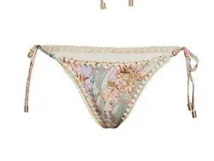 Women's creamy-white floral bikini swimsuit with separate top, underwear, and skirt pieces