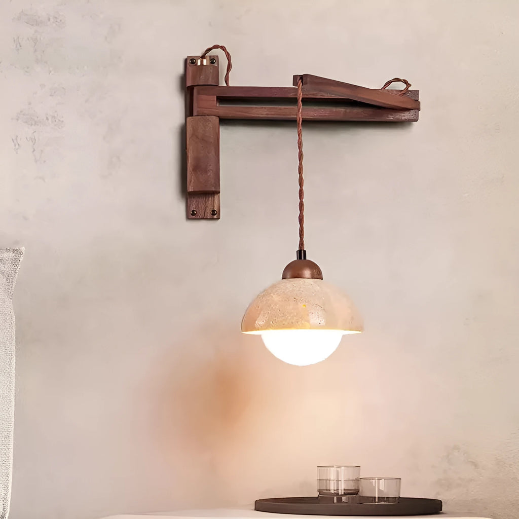Yellow cave stone wall lamp with textured finish installed above bedside table