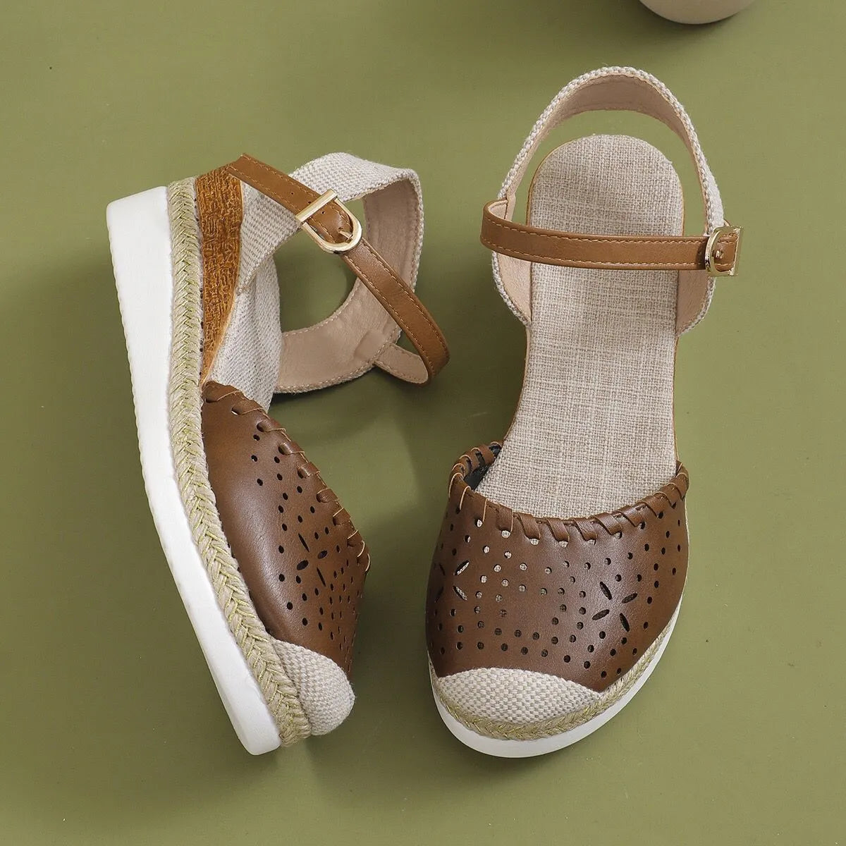 Women's beige hemp rope platform wedge shoes with round toe and PU leather upper.