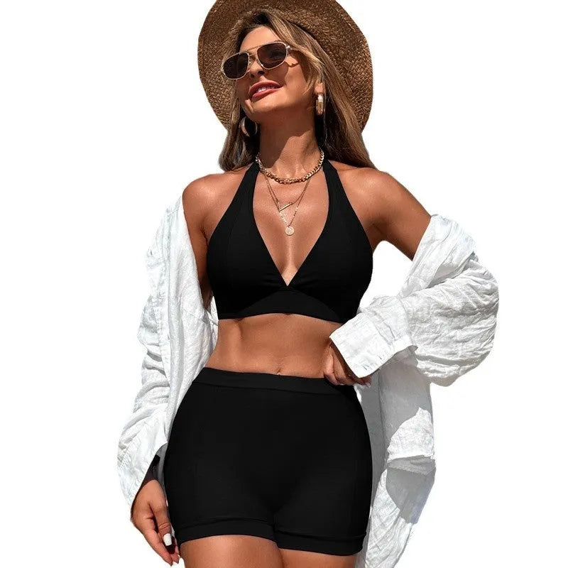 Women's black nylon bikini swimsuit with sleeveless design on a mannequin.