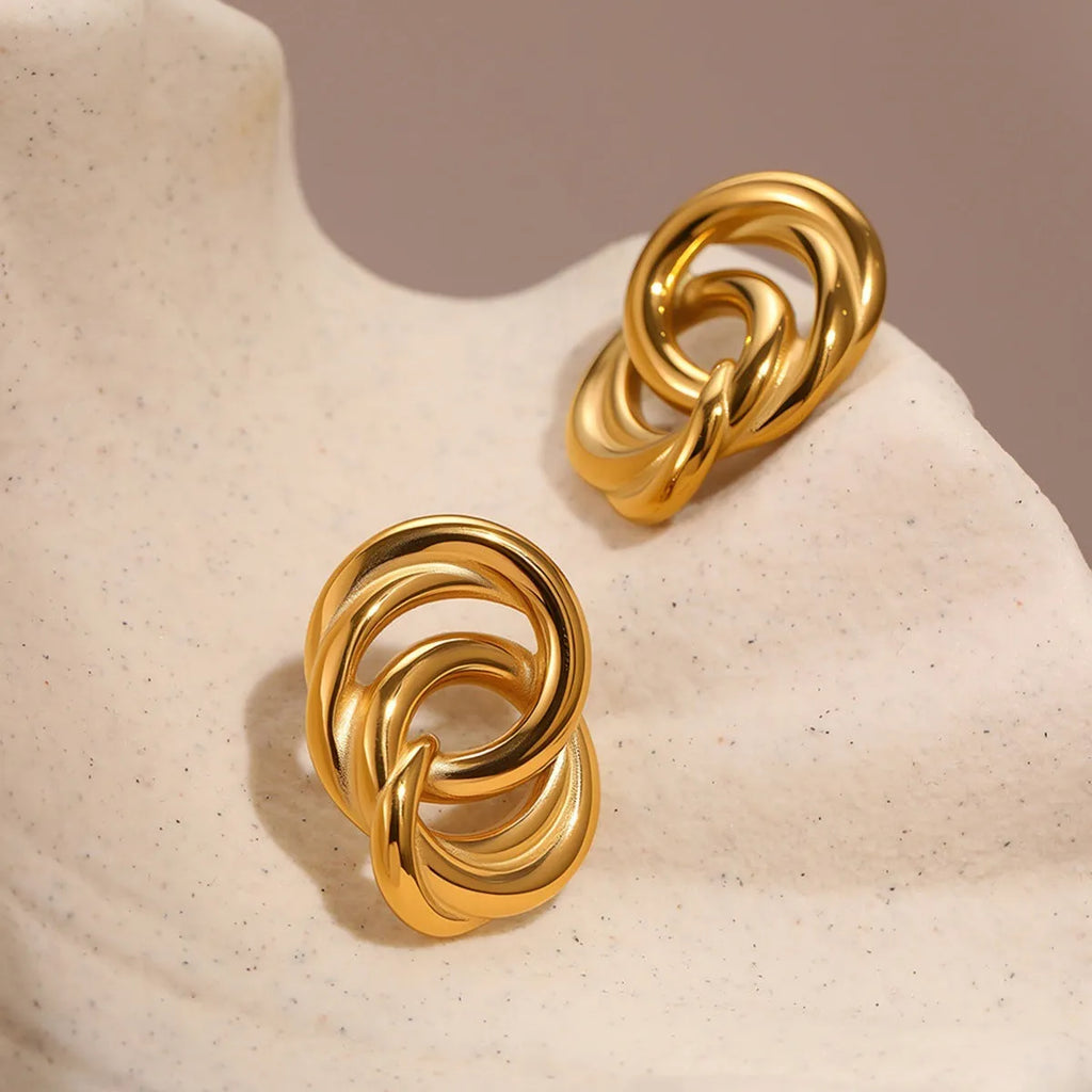 18K gold electroplated stainless steel geometric circle stud earrings on display