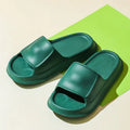 Pair of thick-soled EVA flip flop slippers in a colour option, showing non-slip tread pattern.