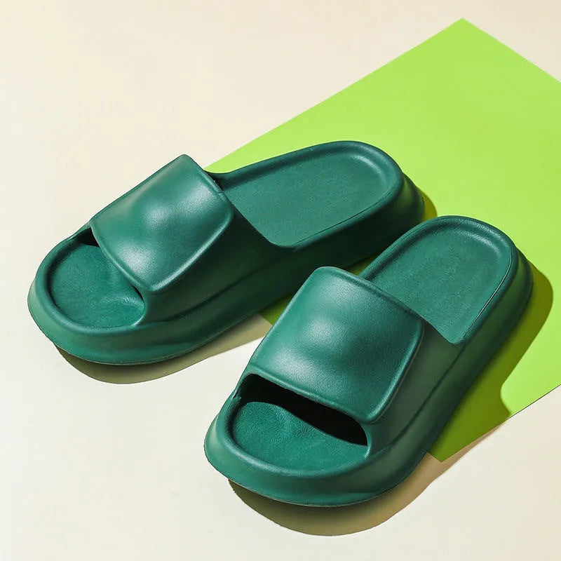 Pair of thick-soled EVA flip flop slippers in a colour option, showing non-slip tread pattern.