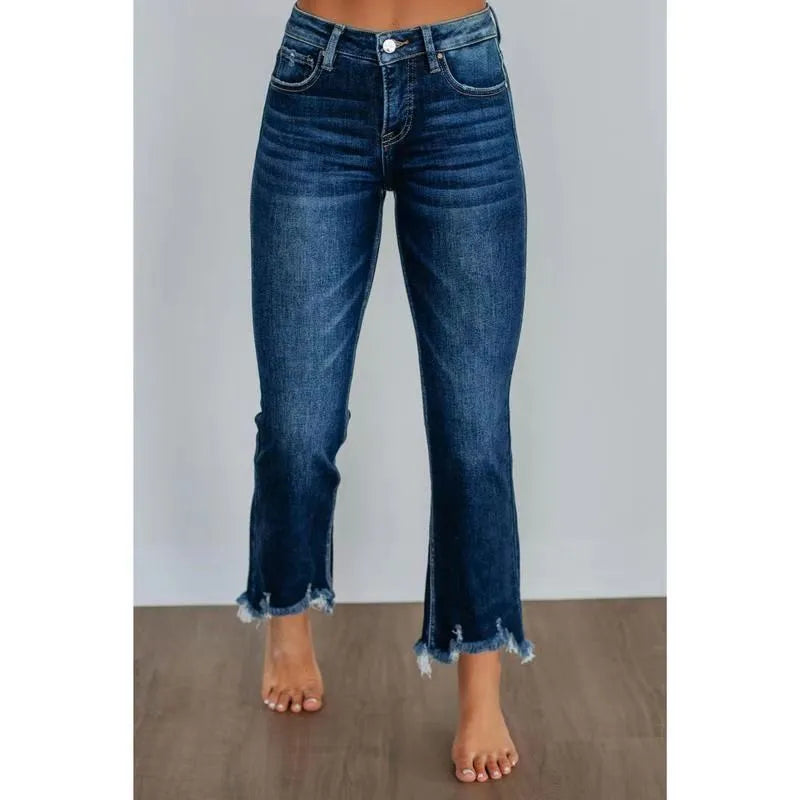 Women's casual denim trousers with manual distressing in dark blue or light blue.
