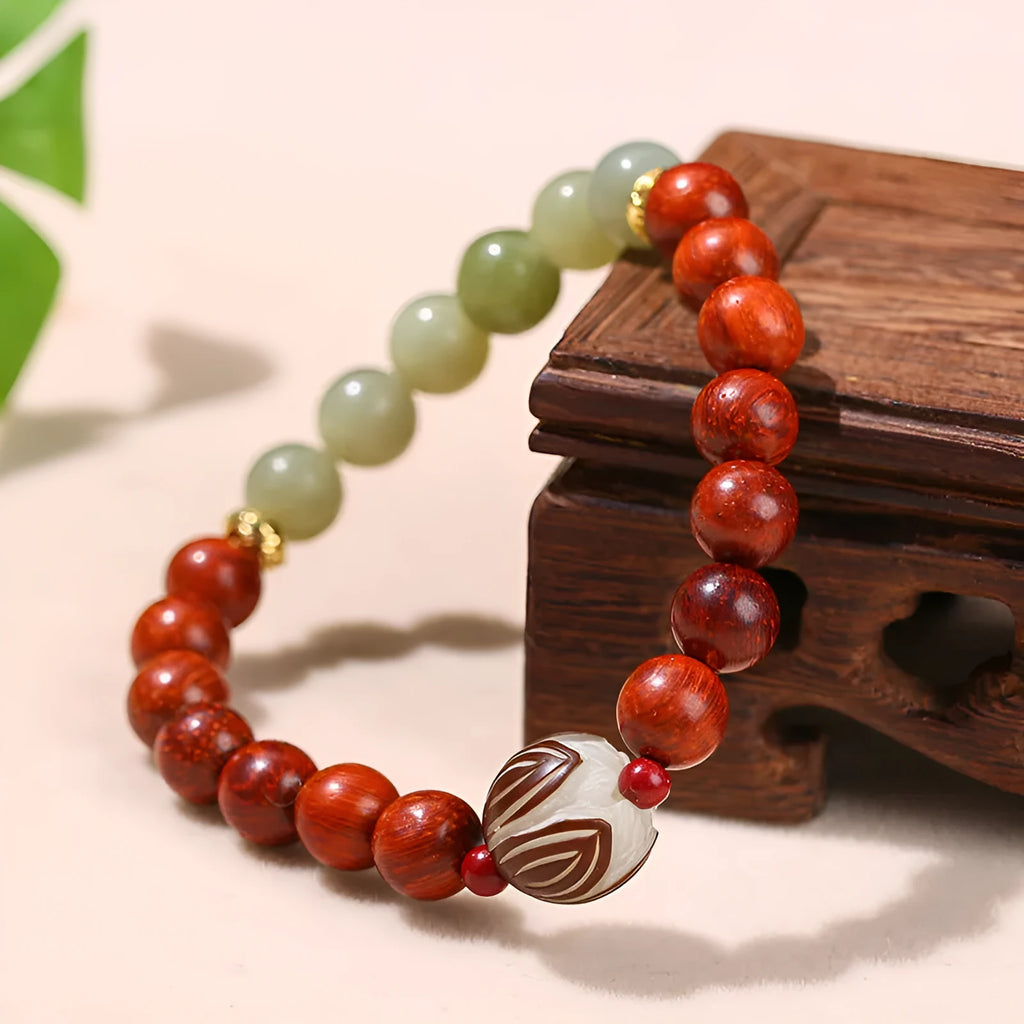 Red rosewood and gray jade Bodhi Lotus bracelet with geometric round beads.