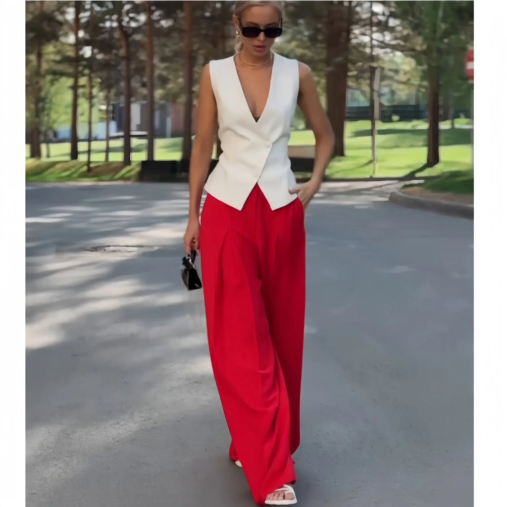 Women's beige two-piece set with sleeveless deep V-neck top and high-waisted wide-leg trousers