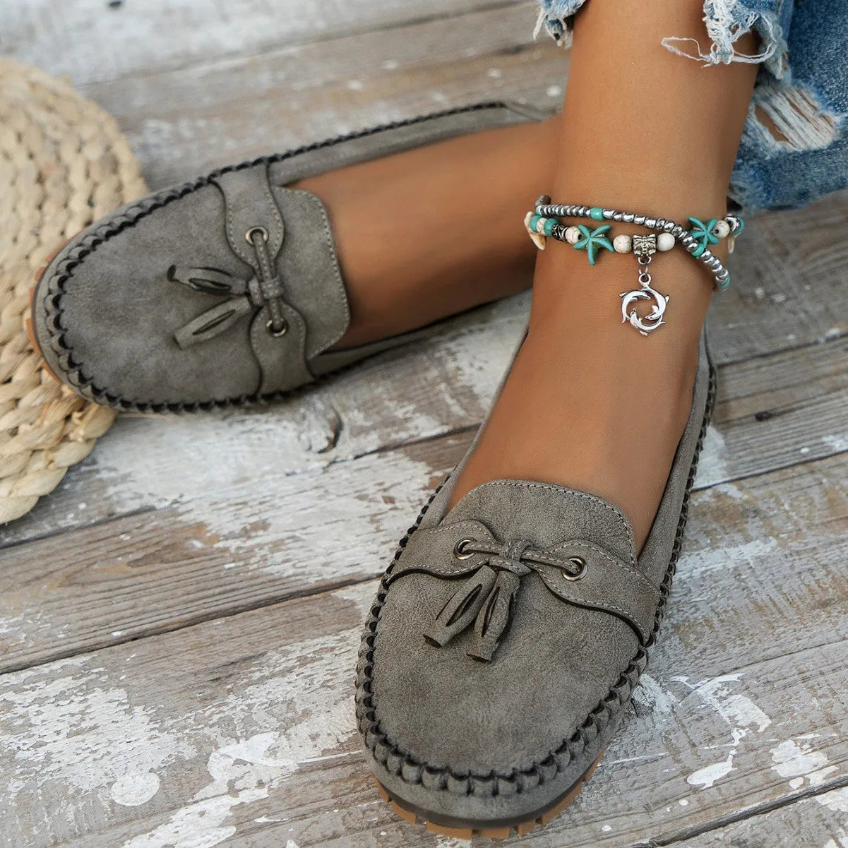 Women's suede flat shoes with a decorative bow in apricot colour
