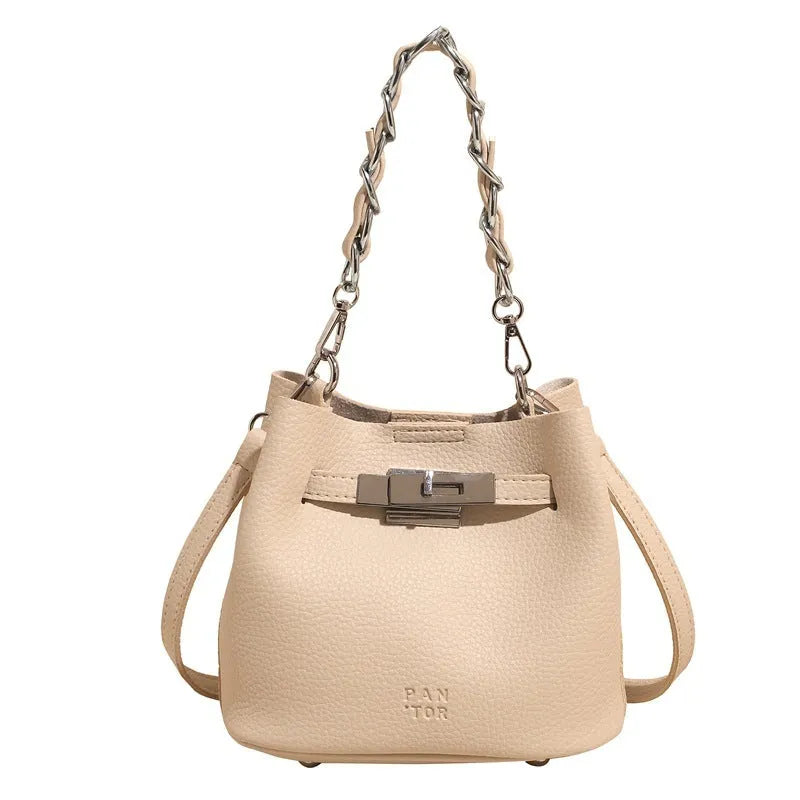 Soft PU leather retro bucket shoulder bag in black showing internal organiser pockets.