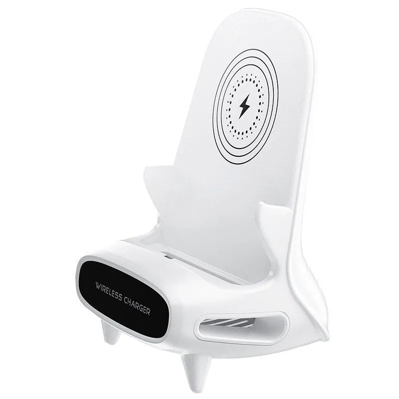 White mini chair-shaped wireless charging stand holding a mobile phone at an angle.