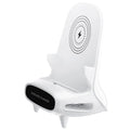 White mini chair-shaped wireless charging stand holding a mobile phone at an angle.