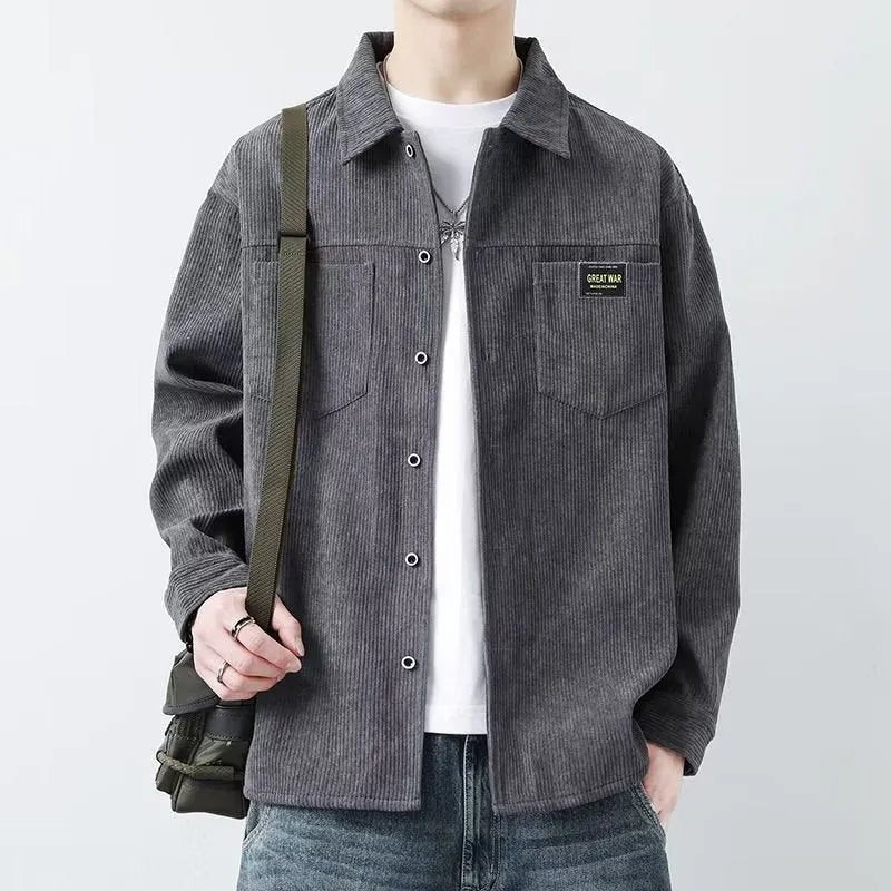 Men's black corduroy cardigan jacket with long sleeves on a hanger.