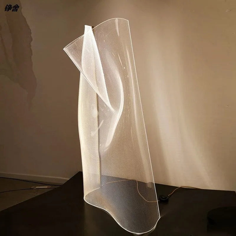 Acrylic irregular ribbon table lamp with warm light on bedside table 360x480mm