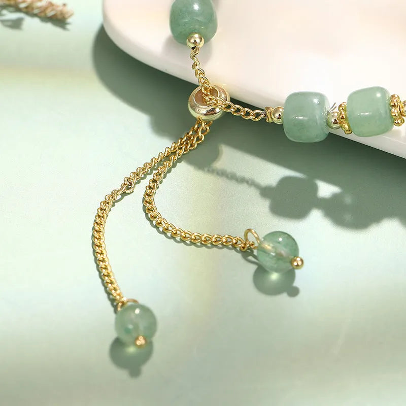 Adjustable rabbit charm bracelet with green aventurine or strawberry quartz stone beads and gold accents