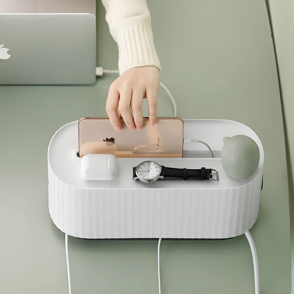 Blue and white power strip storage box with lid open showing cable management holes