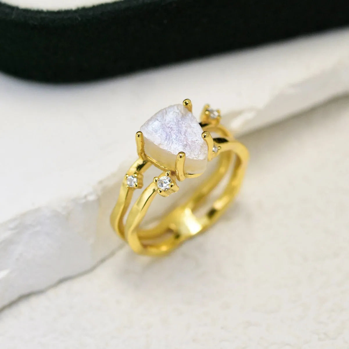 S925 sterling silver moonstone ring with irregular triangle geometry on model finger