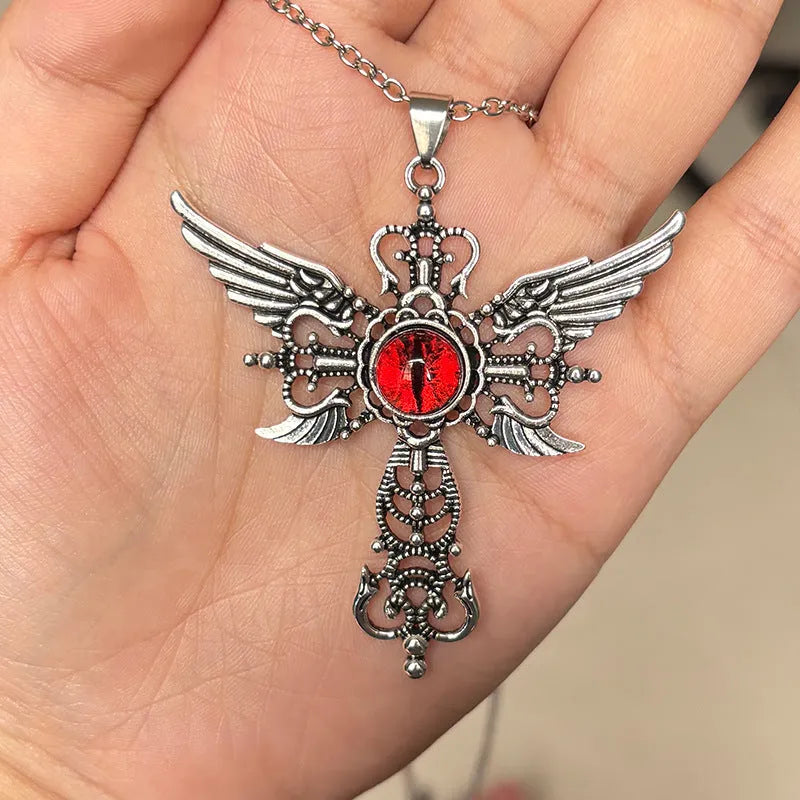 Geometric alloy pendant necklace featuring detailed devil wings and a cross, shown in multiple colour options.