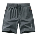 Men's black loose-fit ice silk basketball shorts for summer sports on a plain background.