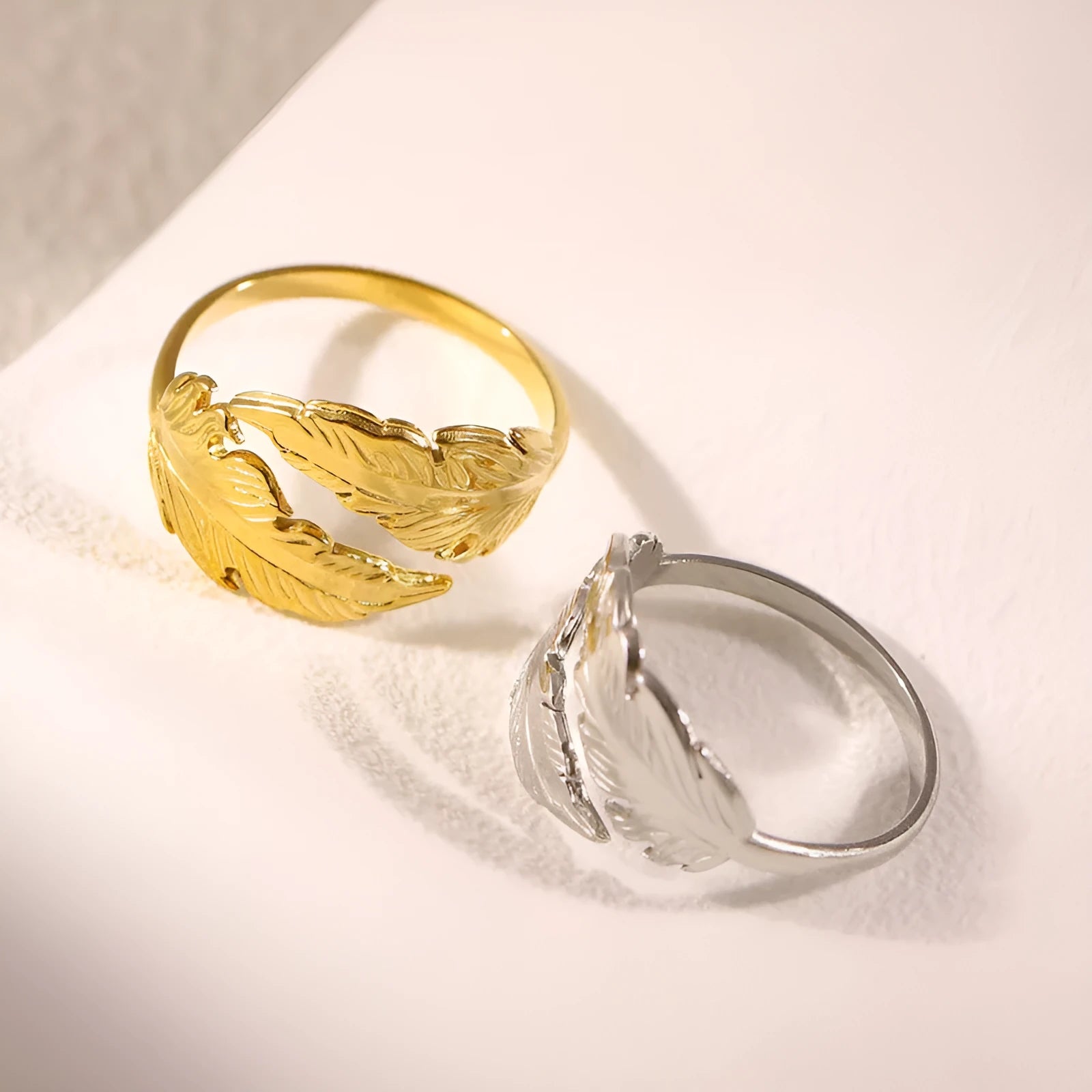 Adjustable stainless steel feather ring showing electroplated finish in silver or gold colour option