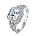 Platinum-colour hollow geometric ring with an inlaid cubic zirconia stone, shown from the side.