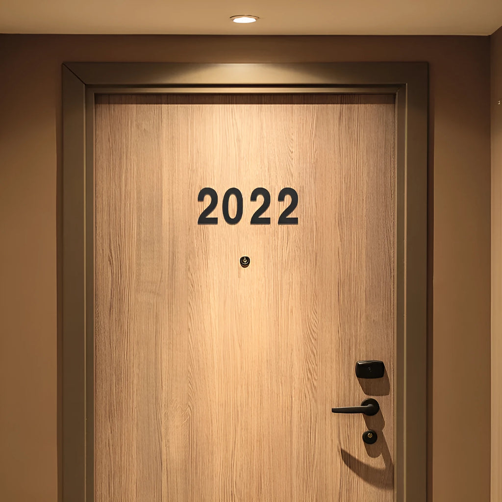 Black stainless steel sticky house number showing the digit 7, 7.5cm in size