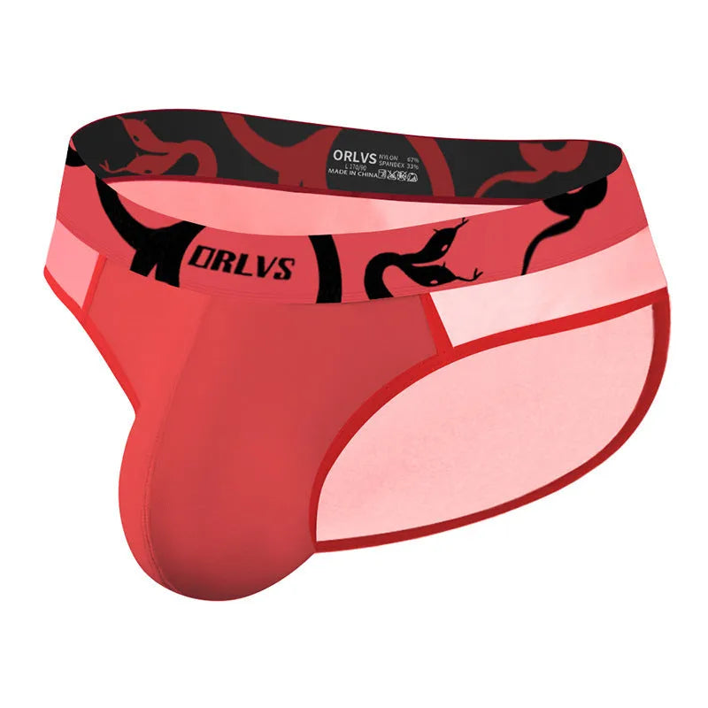 Men's solid colour modal boxer shorts with a low waist design, shown in black, pink, and red.