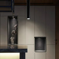 Black round surface mounted LED ceiling downlight spotlight in warm white or cool white light.